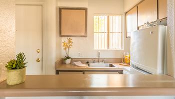 El Encanto kitchen with food pantry.